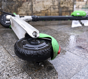 lying electric scooter sharing wet ground cloudy weather bucharest romania